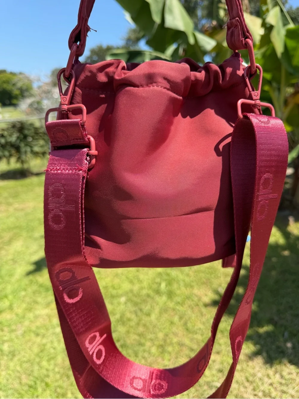 ALO Yoga Burgundy  Drawstring Mini Bucket Bag with Multicolor Cord Tassels